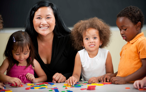 Teacher with three school kids