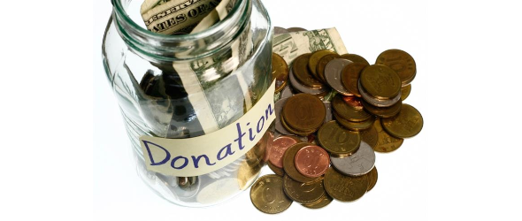 Donation dollars and coins in a jar